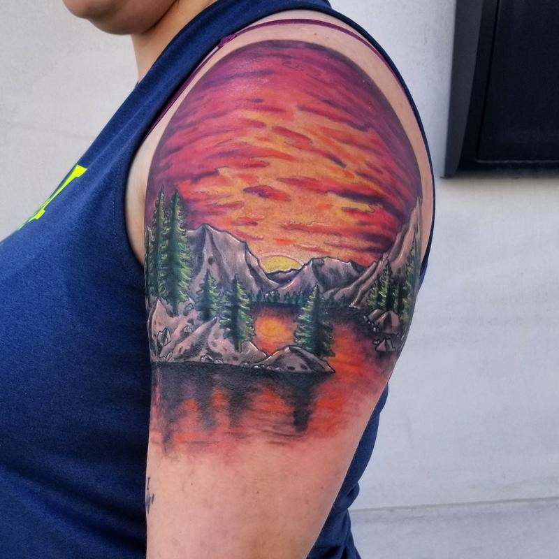 color trees sunset mountain range shoulder tattoo by Cody Cook : Tattoos